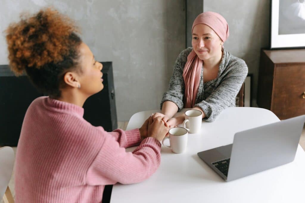 Two women enjoying a coffee conversation at a table.