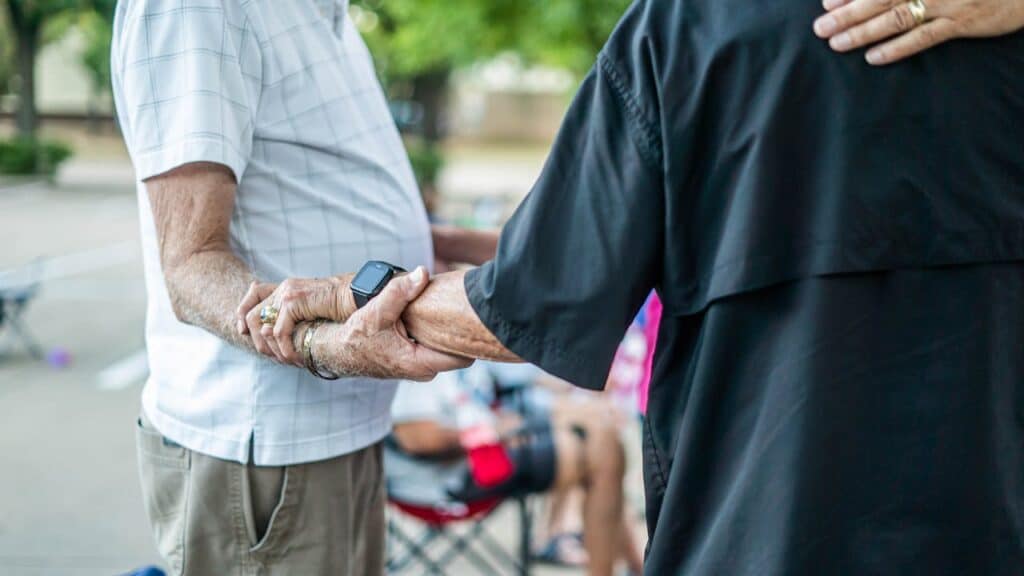 close-up of elderly hands holding each other