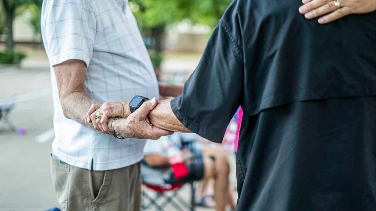 close-up of elderly hands holding each other